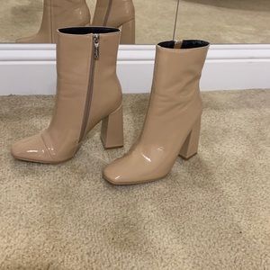 Nude patent booties